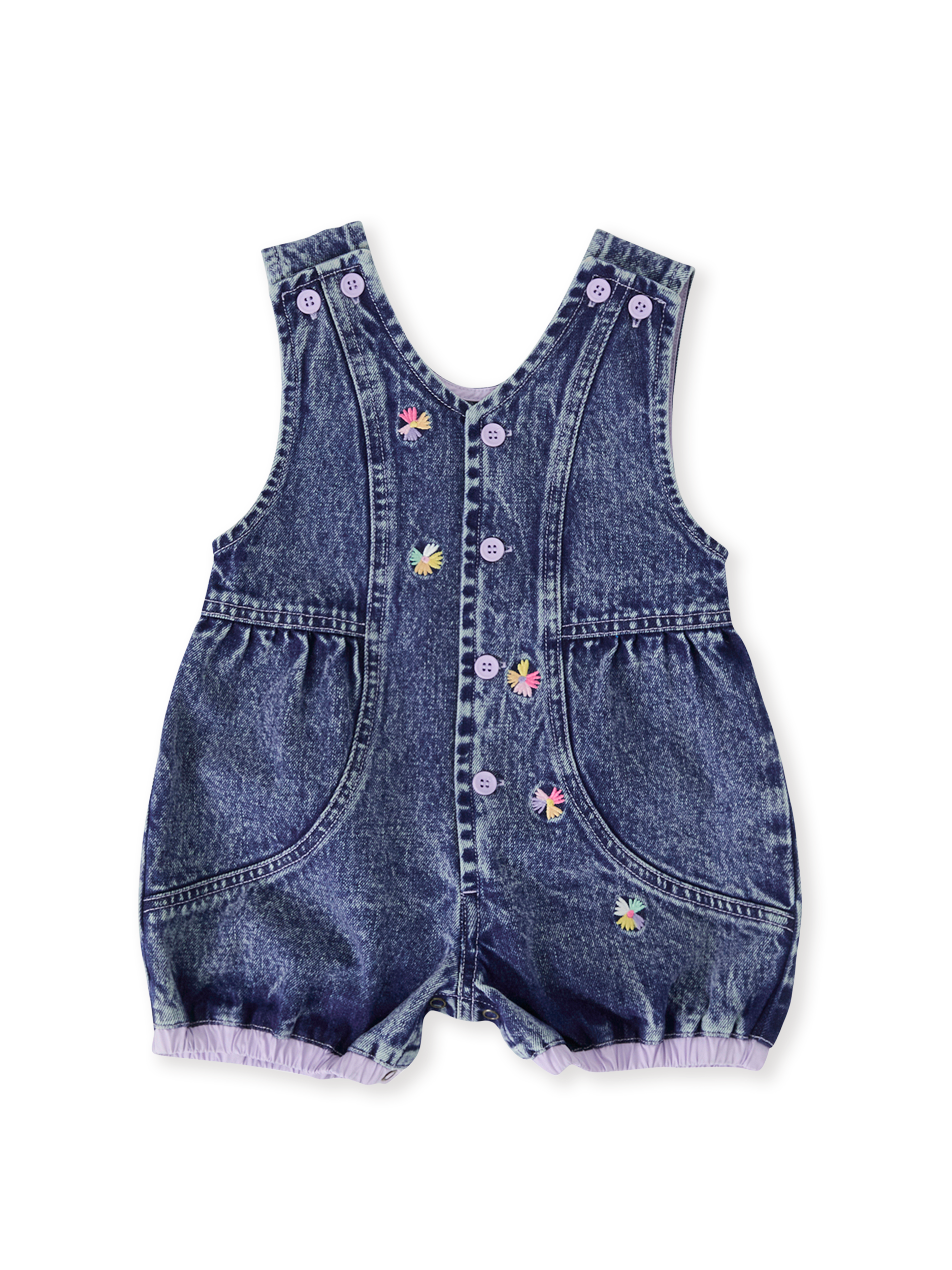 The Goldie + Ace Nina Pastel Petals Denim Romper in Dark Denim pictured on a transparent background. The material is 100% cotton. It is a romper made for babies, toddlers and kids.