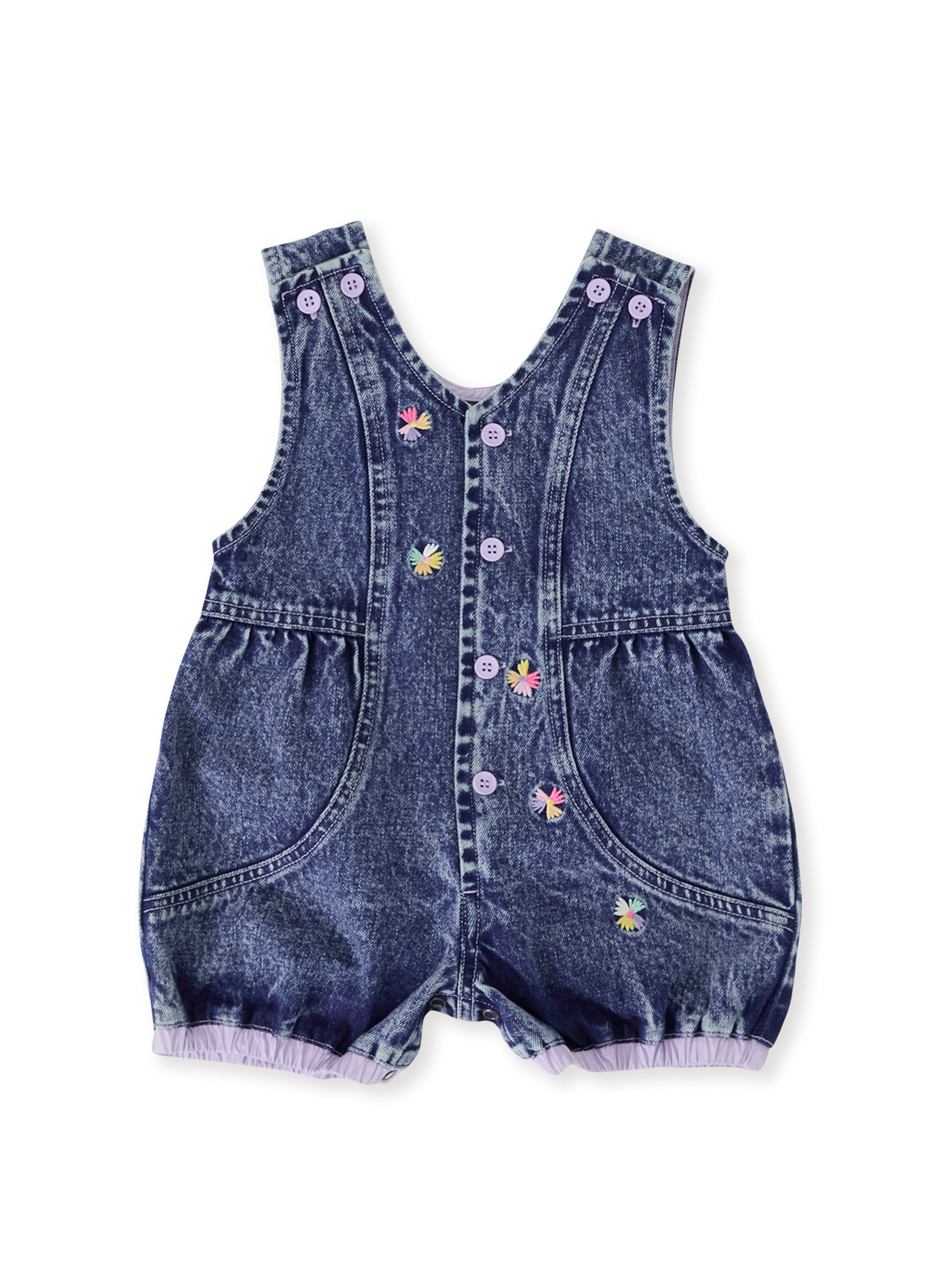 The Goldie + Ace Nina Pastel Petals Denim Romper in Dark Denim pictured on a transparent background. The material is 100% cotton. It is a romper made for babies, toddlers and kids.