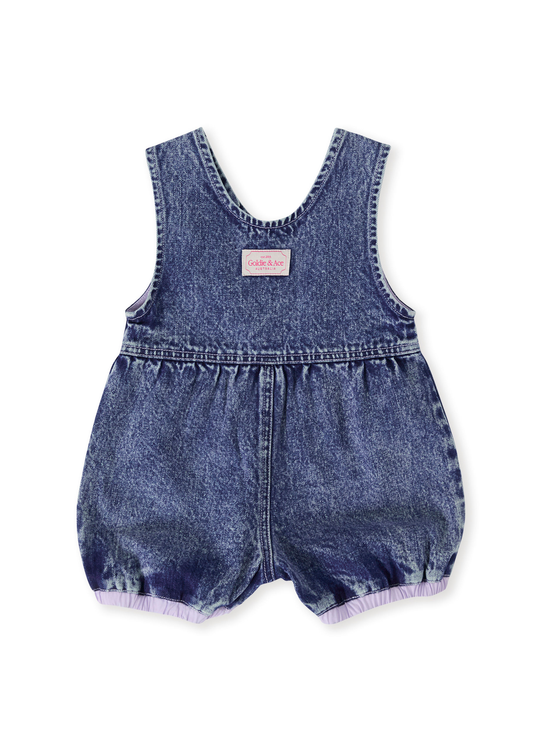 The Goldie + Ace Nina Pastel Petals Denim Romper in Dark Denim pictured on a transparent background. The material is 100% cotton. It is a romper made for babies, toddlers and kids.