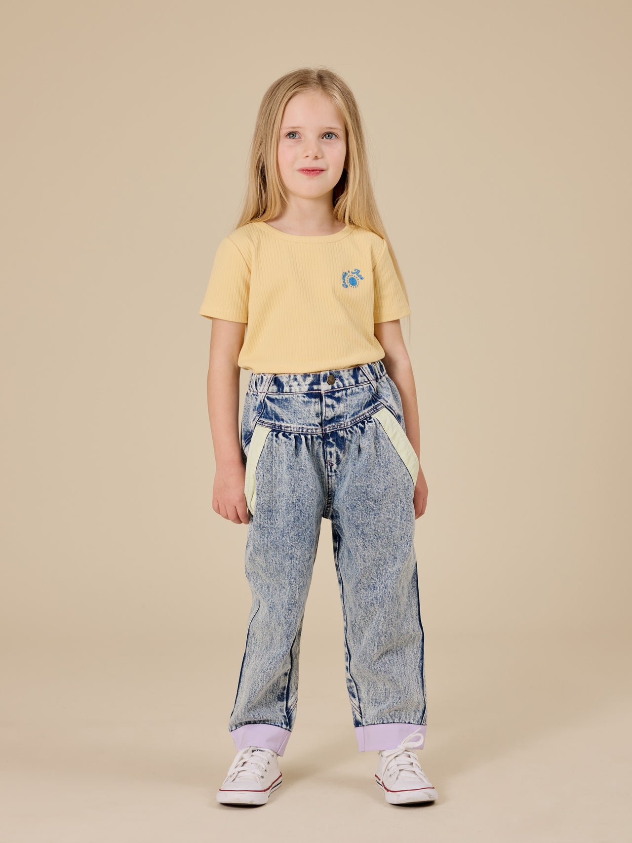 The Goldie + Ace Kai Rib T-Shirt in Lemon pictured on a transparent background. The material is soft cotton elastane. It is a top made for babies, toddlers and kids.