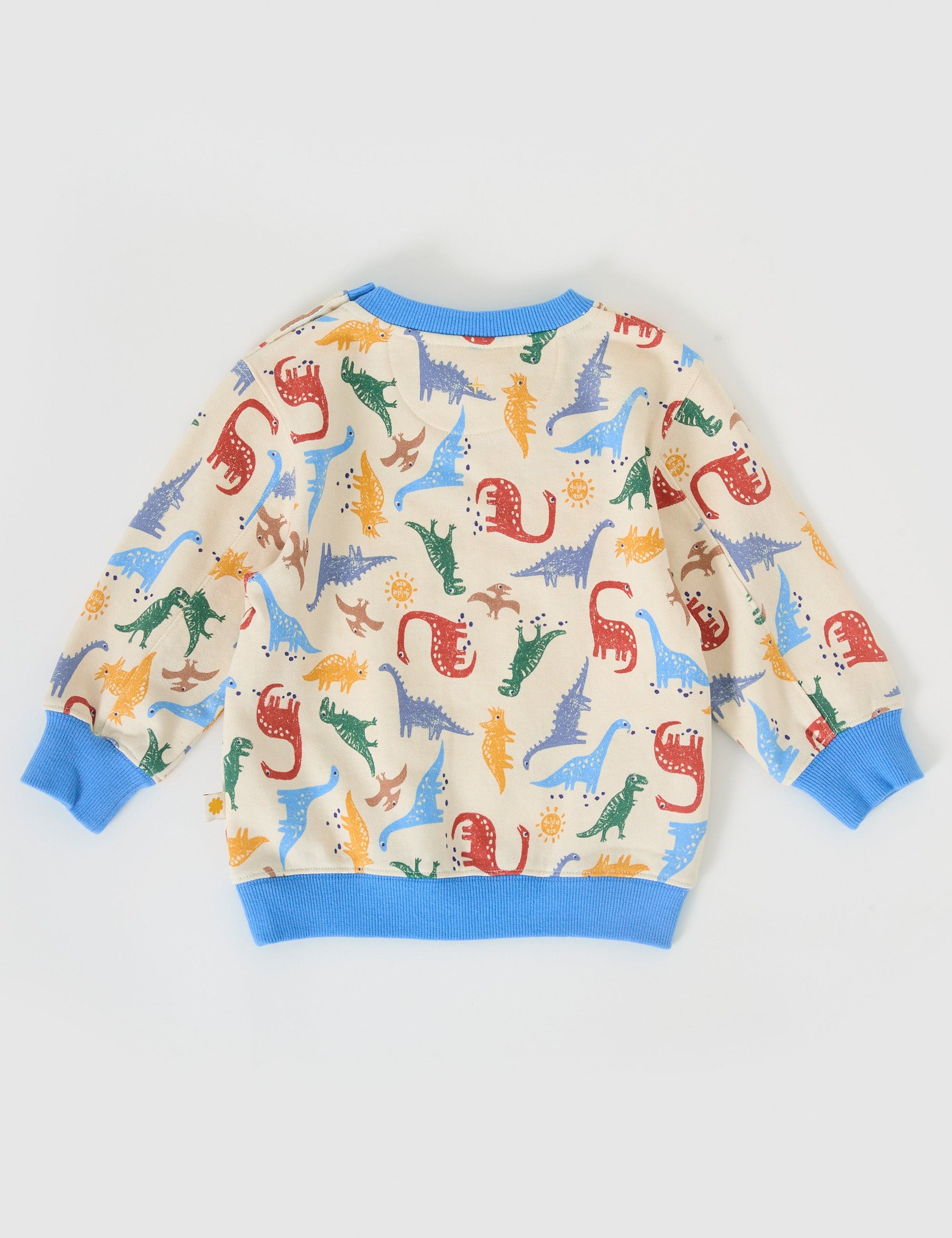 The Goldie + Ace Dino-Mite Relaxed Terry Sweater in Multi pictured on a grey background. The material is cotton terry. It is a top made for babies, toddlers and kids.