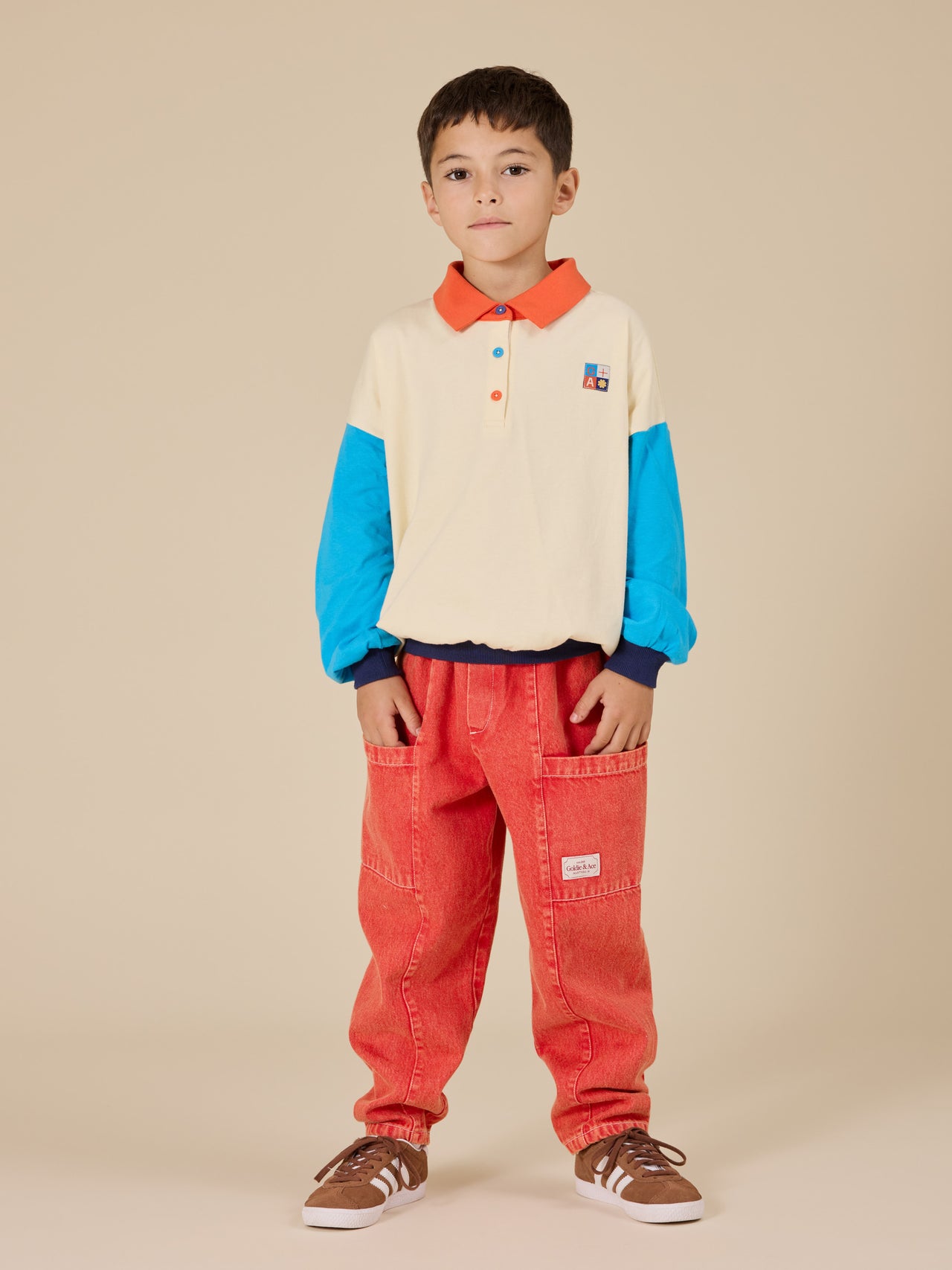 The Goldie + Ace Relaxed Rugby Sweat Top in Vanilla/Lake pictured on a transparent background. The material is 100% cotton. It is a top made for babies, toddlers and kids.