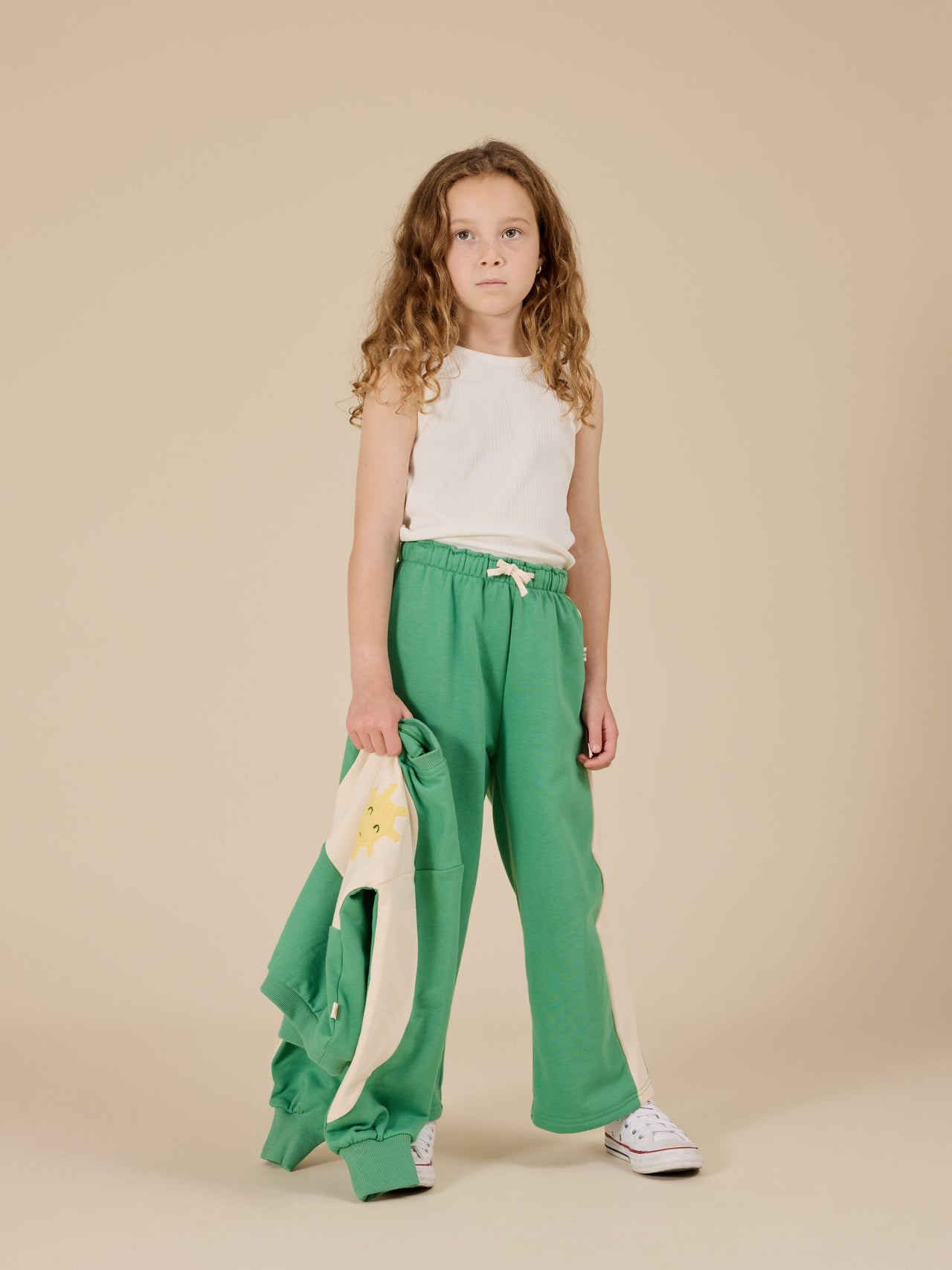 The Goldie + Ace Arlo Wide Leg Pant in Fern/Vanilla pictured on a transparent background. The material is 100% cotton. It is a bottom made for babies, toddlers and kids.