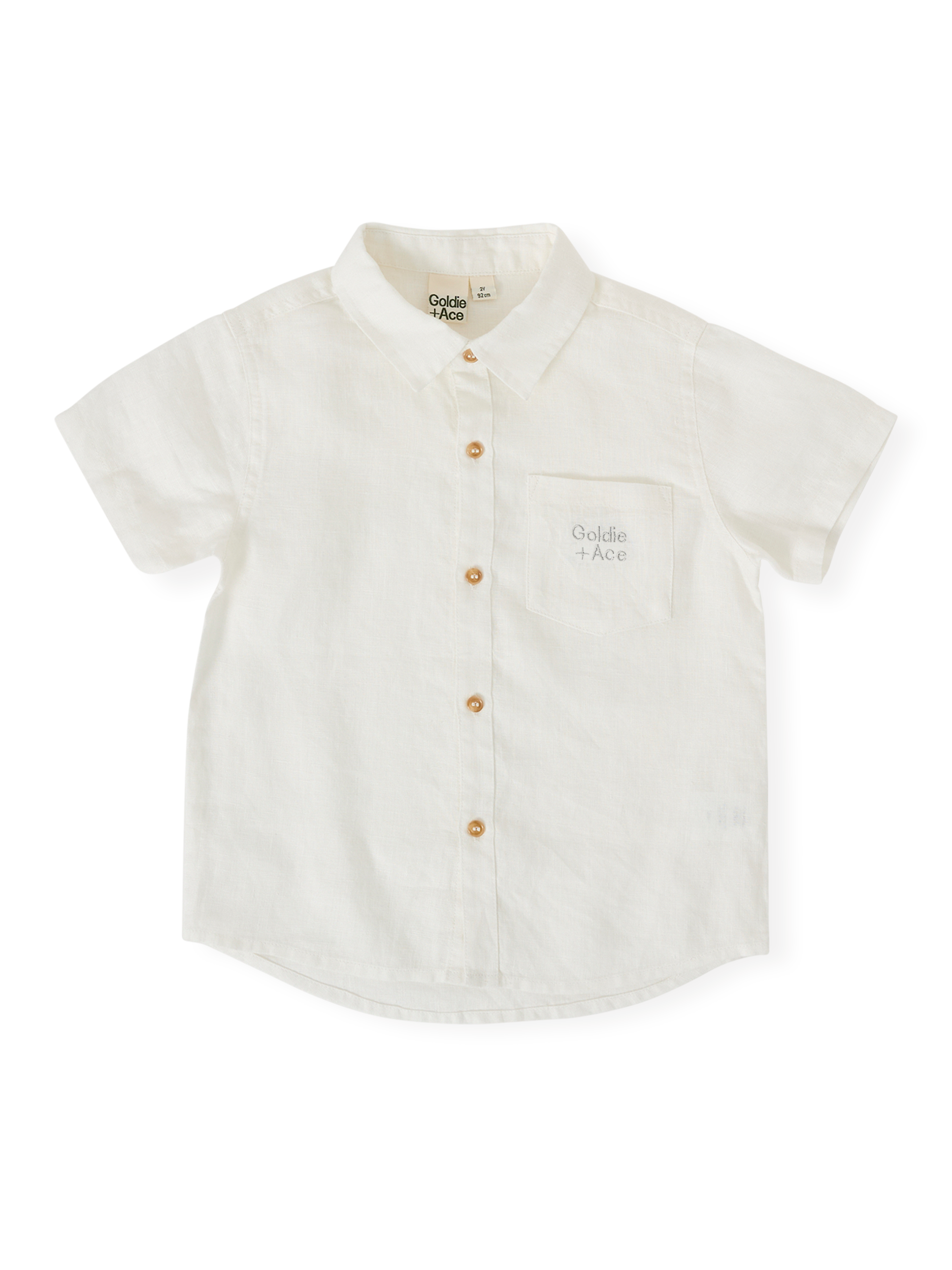 The Goldie + Ace Holiday Linen Blend Shirt in White pictured on a transparent background. The material is 100% cotton. It is a top made for babies, toddlers and kids.