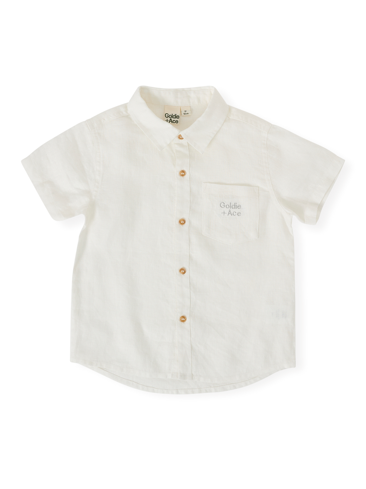 The Goldie + Ace Holiday Linen Blend Shirt in White pictured on a transparent background. The material is 100% cotton. It is a top made for babies, toddlers and kids.