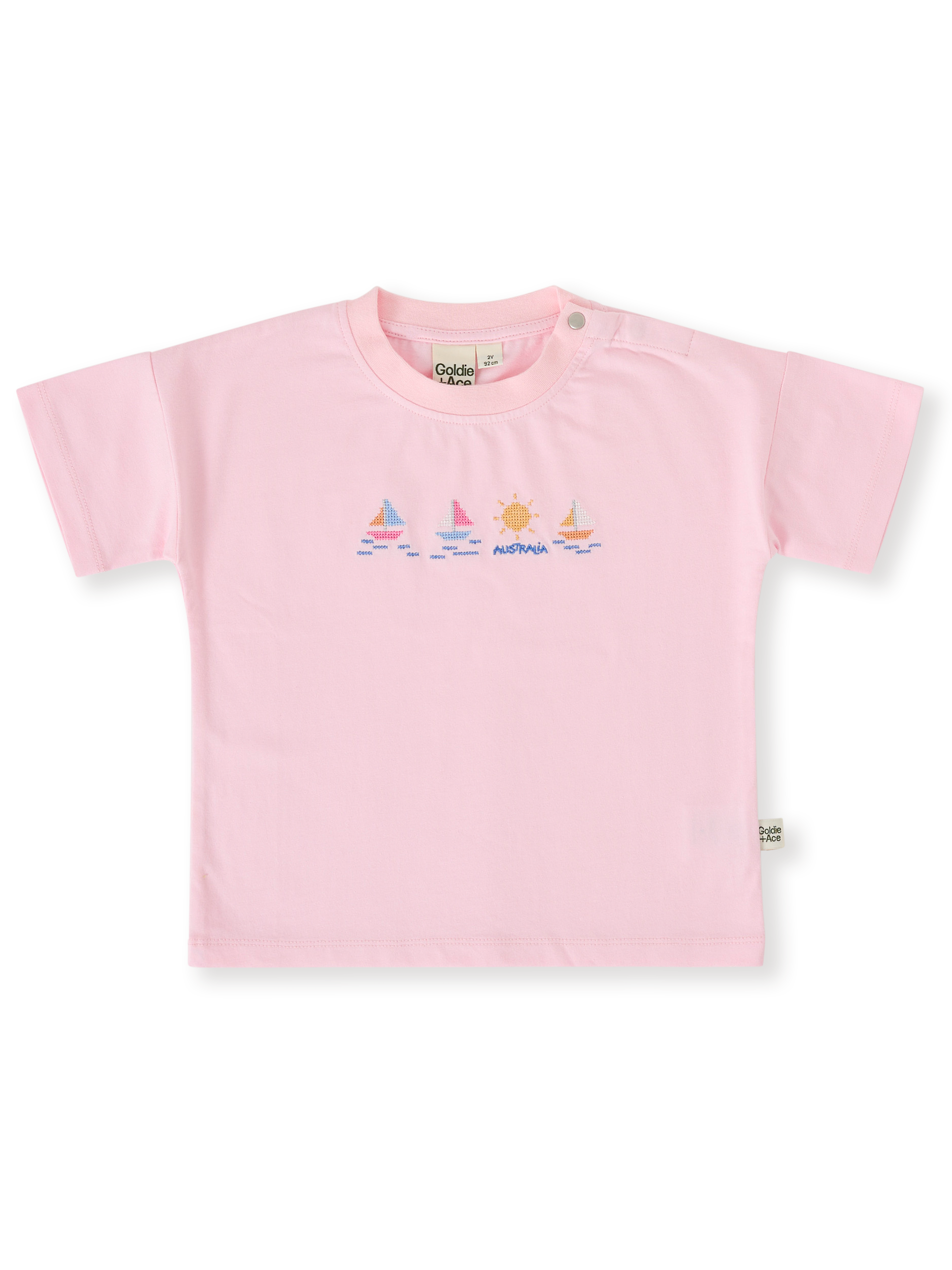 The Goldie + Ace Seaside Sailing T-Shirt in Candy pictured on a transparent background. The material is 100% cotton. It is a top made for babies, toddlers and kids.