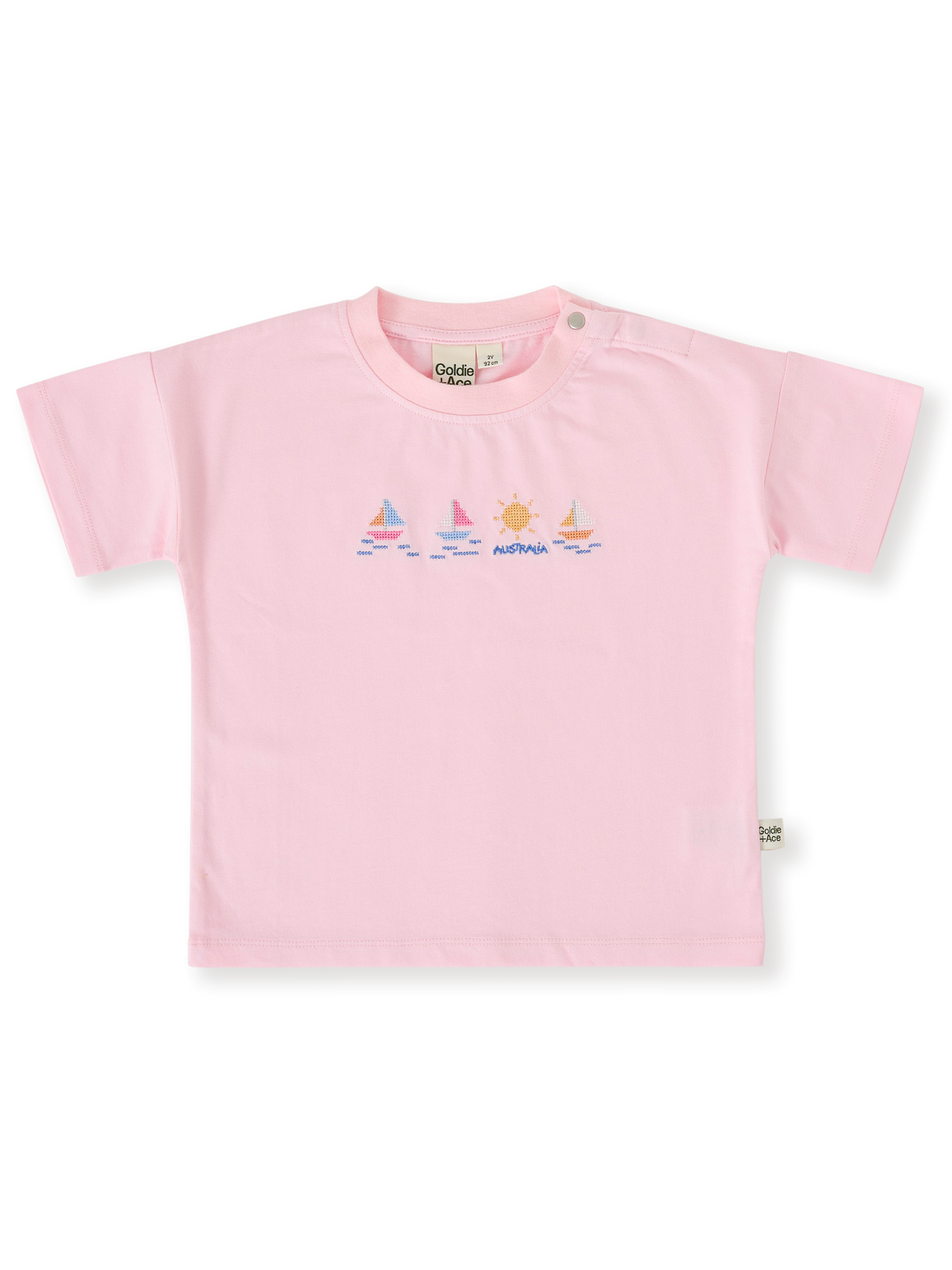 The Goldie + Ace Seaside Sailing T-Shirt in Candy pictured on a transparent background. The material is 100% cotton. It is a top made for babies, toddlers and kids.