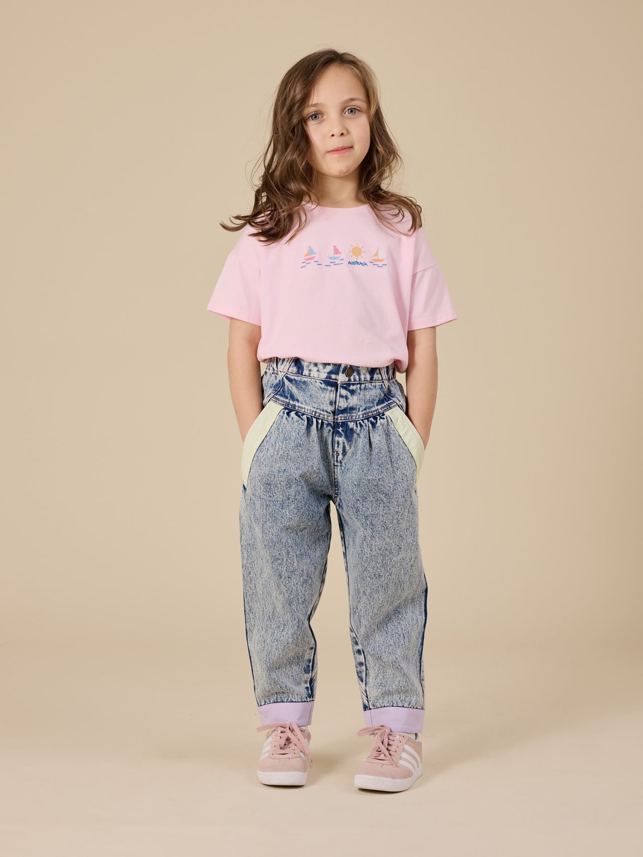 The Goldie + Ace Pastel Pop Nora Denim Pant in Light Denim pictured on a transparent background. The material is cotton. It is a bottom made for babies, toddlers and kids.