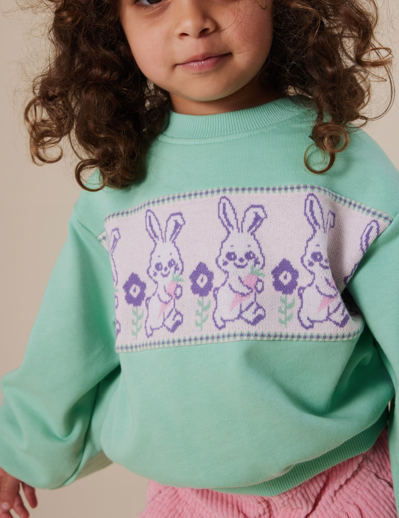 The Goldie + Ace Hazel Puff Sleeve Bunny Sweater in Mint pictured on a grey background. The material is cotton. It is a top made for babies, toddlers and kids.