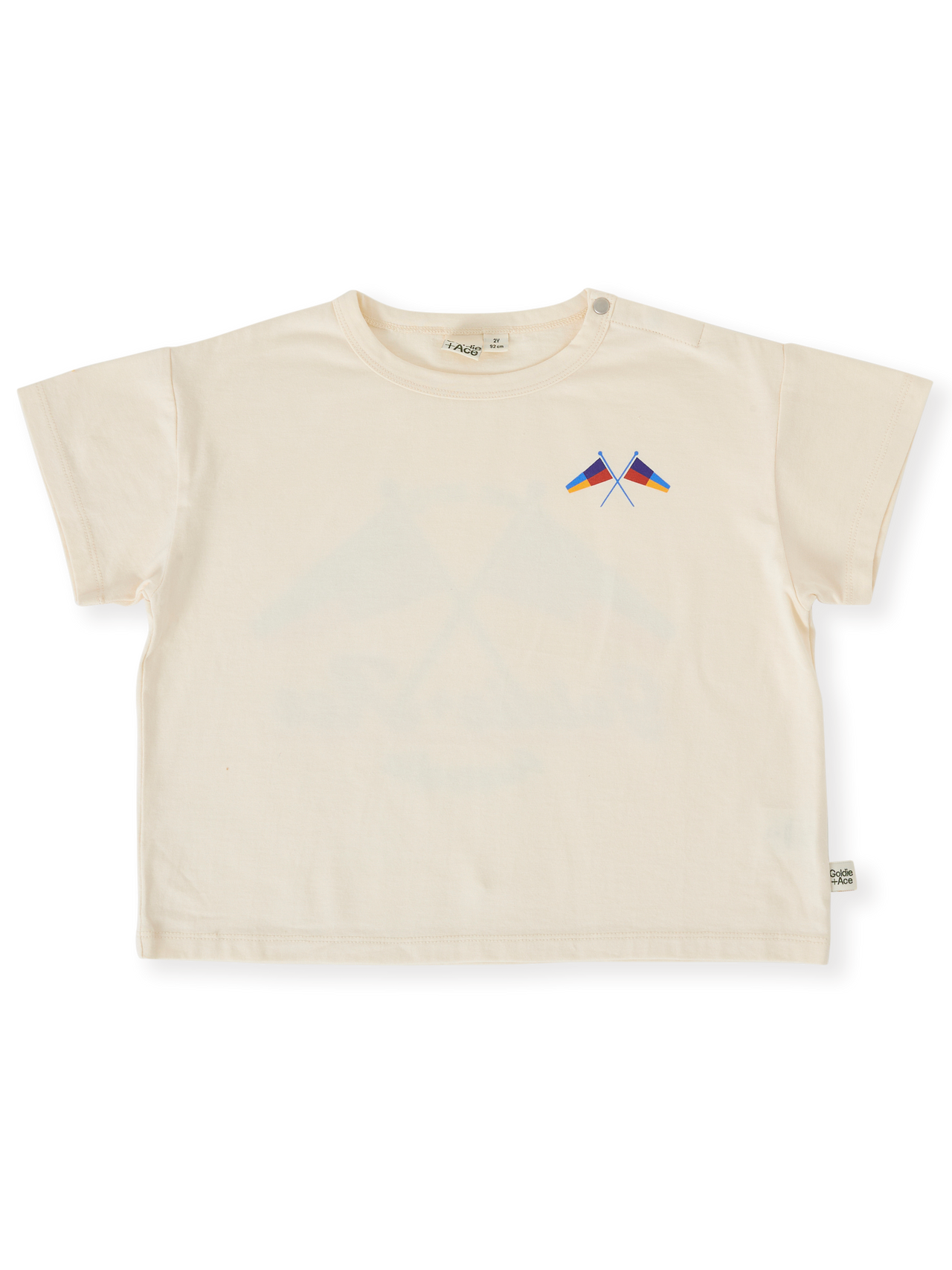 The Goldie + Ace Nautical Flag Oversized T-Shirt in Cream pictured on a transparent background. The material is 100% cotton. It is a top made for babies, toddlers and kids.