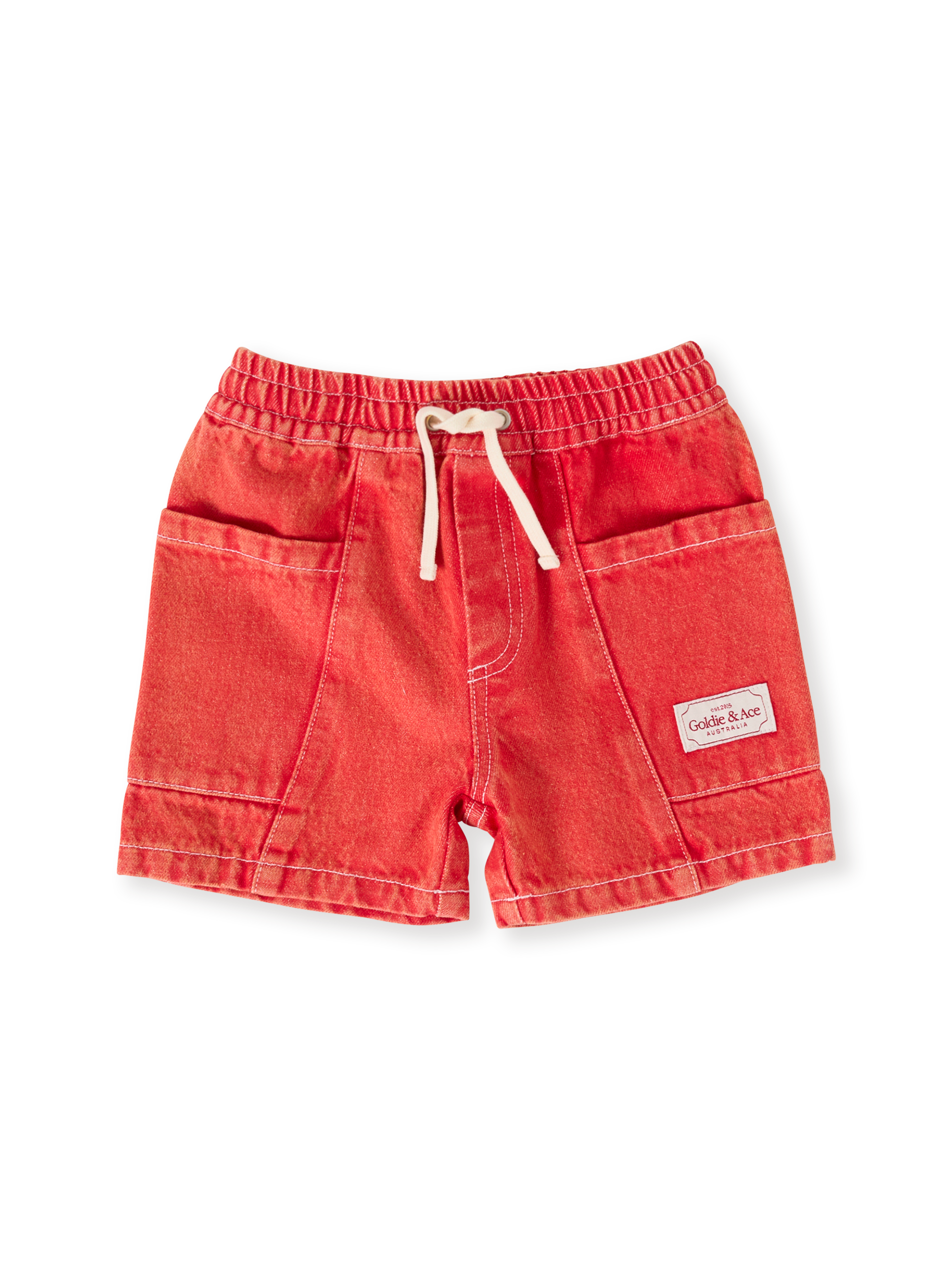 The Goldie + Ace Noah Denim Pocket Shorts in Apple Red pictured on a transparent background. The material is 100% cotton. It is a bottom made for babies, toddlers and kids.
