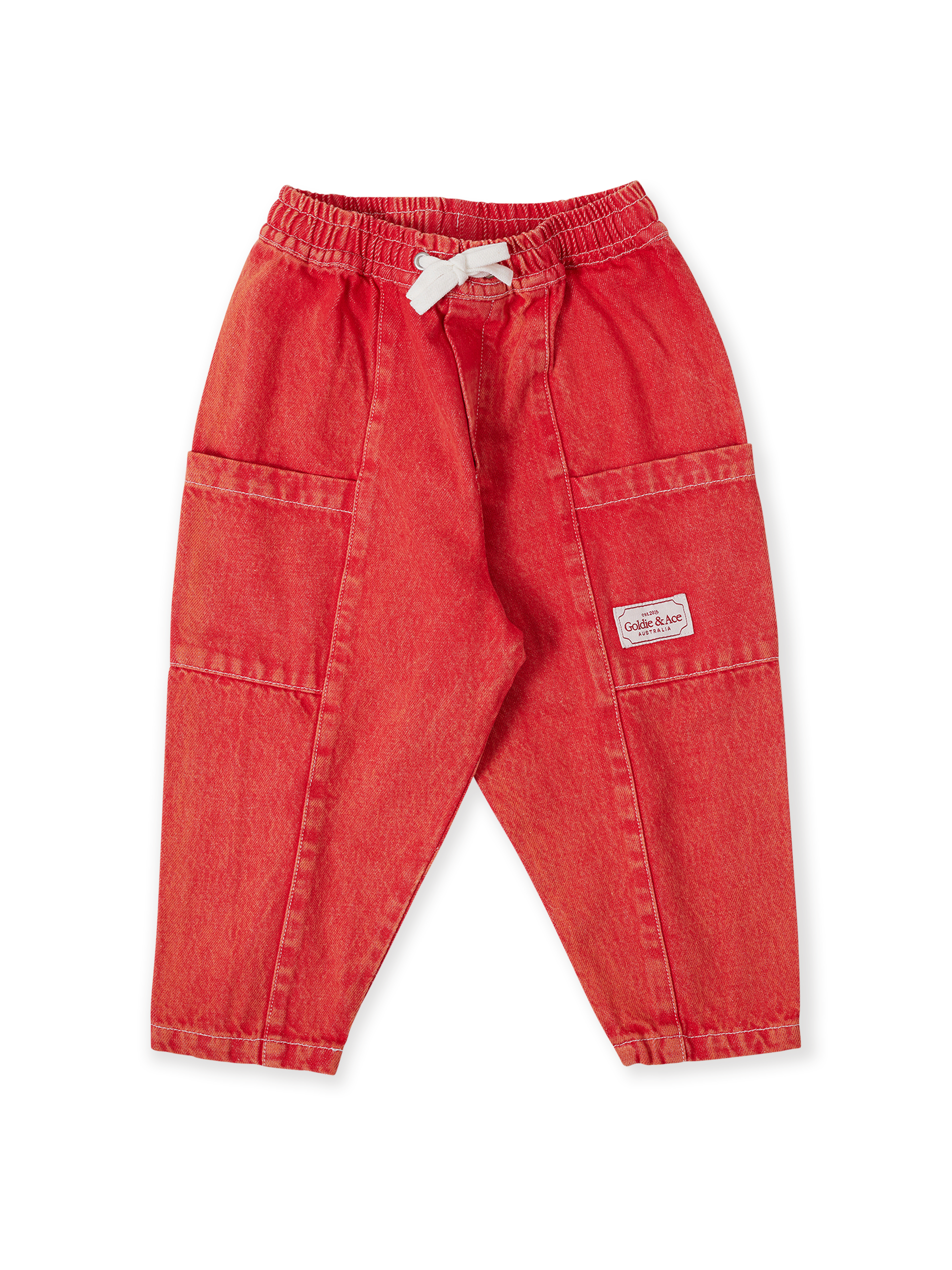 The Goldie + Ace Kit Denim Pocket Pant in Apple Red pictured on a transparent background. The material is 100% cotton. It is a bottom made for babies, toddlers and kids.