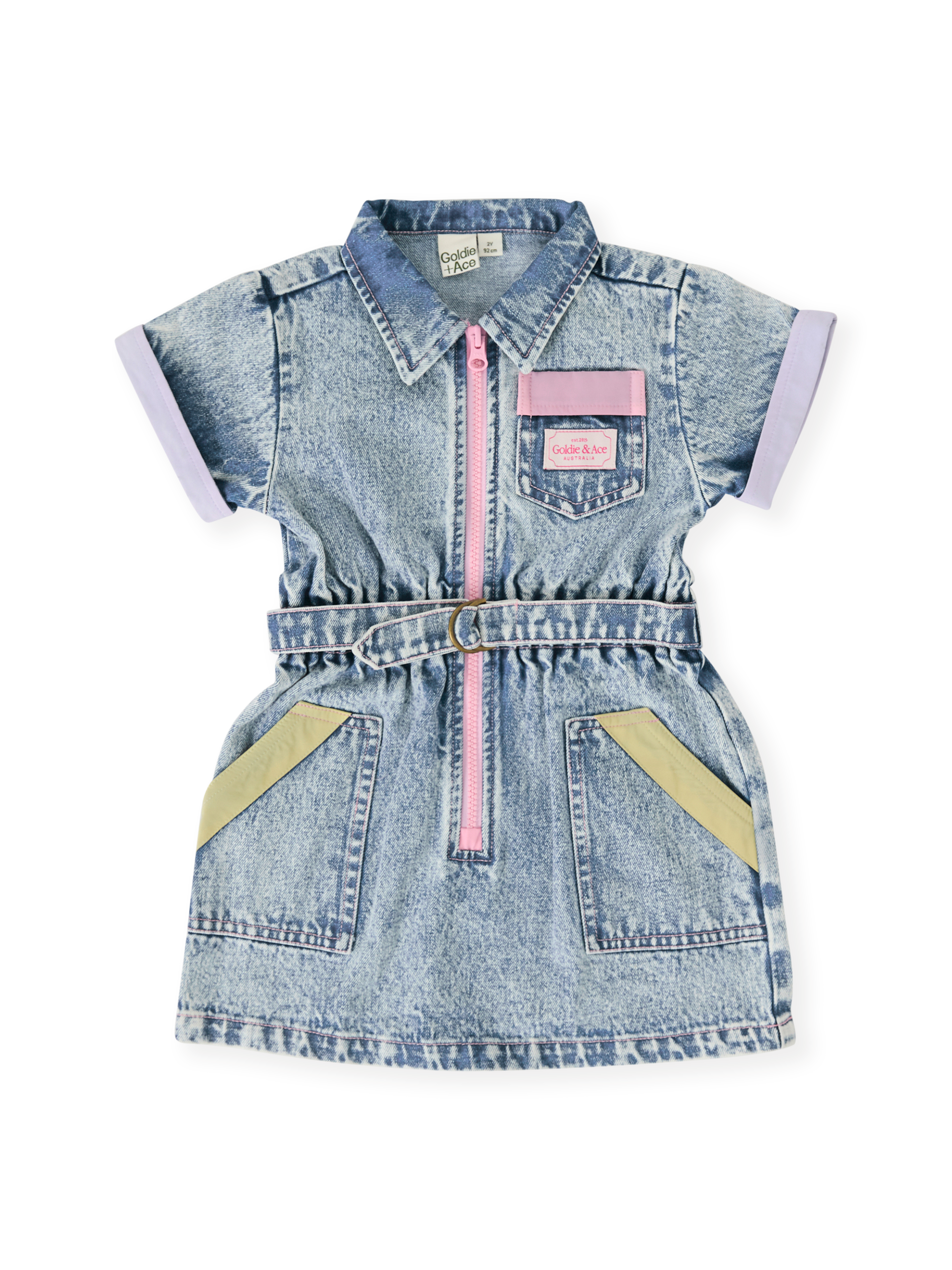 The Goldie + Ace Pastel Pop Piper Denim Belted Dress in Light Denim pictured on a transparent background. The material is cotton. It is a dress made for babies, toddlers and kids.