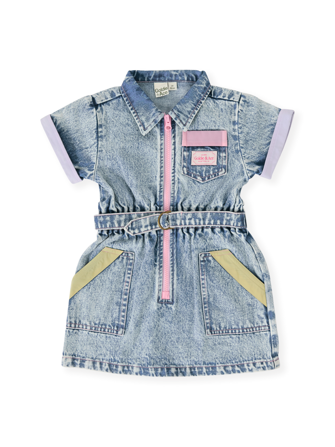 The Goldie + Ace Pastel Pop Piper Denim Belted Dress in Light Denim pictured on a transparent background. The material is cotton. It is a dress made for babies, toddlers and kids.
