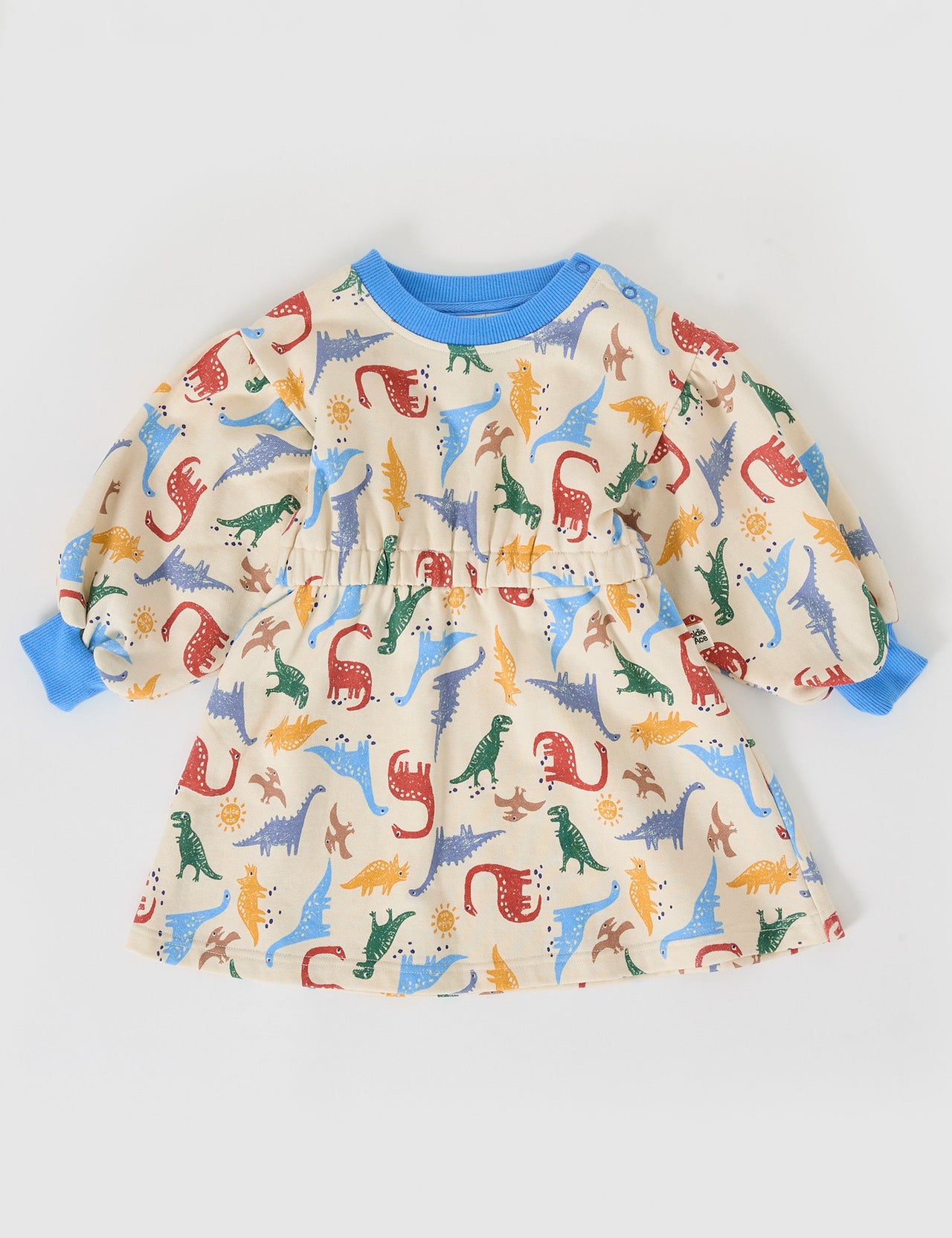The Goldie + Ace Dino-Mite Leah Long Sleeve Dress in Multi pictured on a grey background. The material is cotton terry. It is a dress made for babies, toddlers and kids.