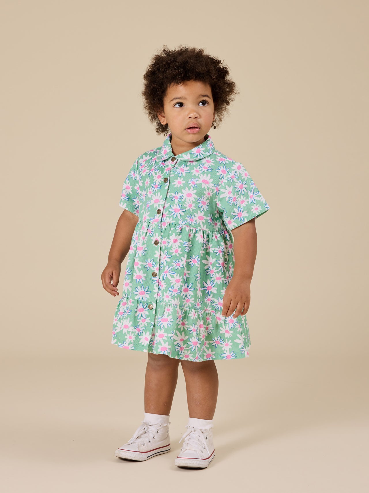 The Goldie + Ace Daisy Patch Monica Dress in Moss pictured on a transparent background. The material is breathable cotton-linen blend. It is a dress made for babies, toddlers and kids.
