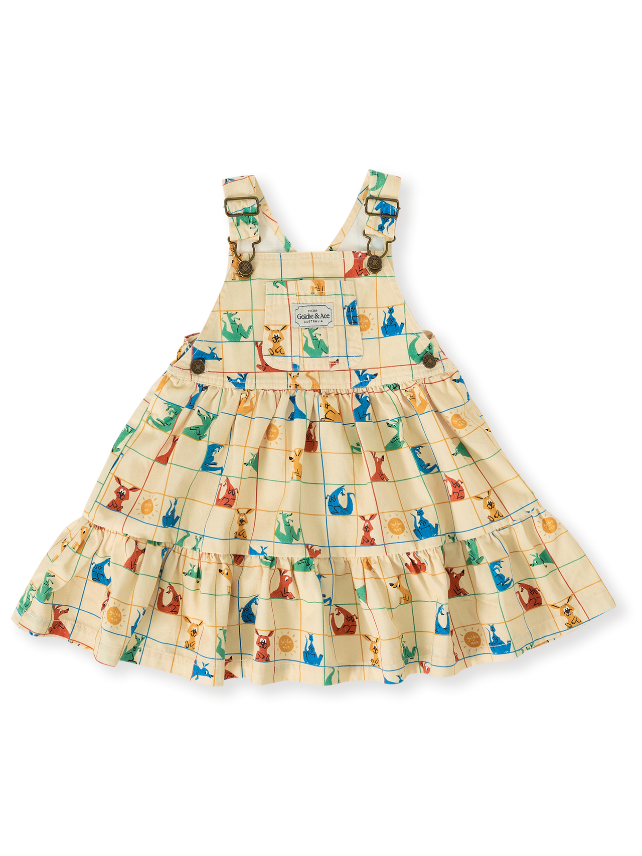 The Goldie + Ace Hopscotch Tully Tiered Pinafore Dress in Vanilla/Primary pictured on a transparent background. The material is 100% cotton. It is a dress made for babies, toddlers and kids.