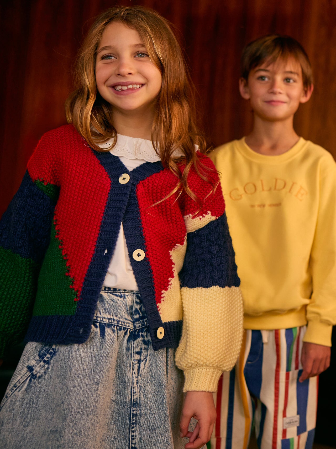 The Goldie + Ace Colour Block Knit Cardigan in Primary Multi pictured on a transparent background. The material is super soft wool blend. It is a knit made for babies, toddlers and kids.