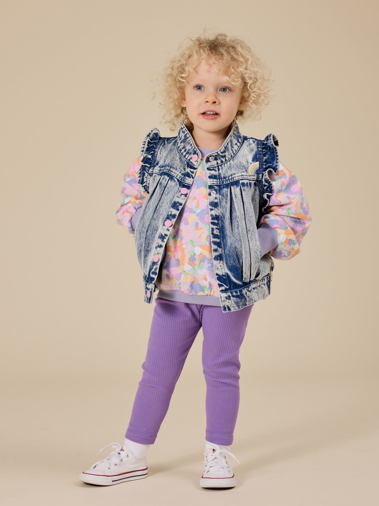 The Goldie + Ace Elodie Embroidered Denim Vest in Light Denim pictured on a transparent background. The material is cotton. It is a top made for babies, toddlers and kids.