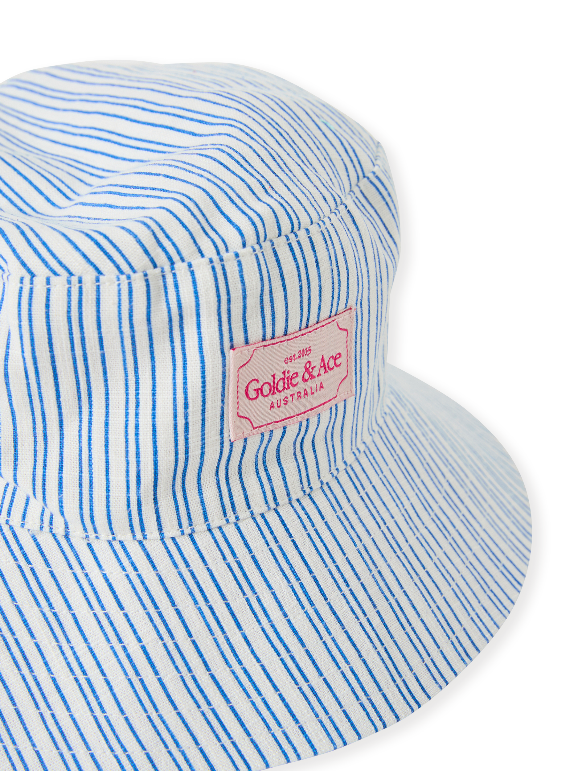 The Goldie + Ace Sailor Stripe Bucket Hat in Ocean/Ivory pictured on a transparent background. The material is soft and breathable rayon-linen blend. It is a accessory made for babies, toddlers and kids.