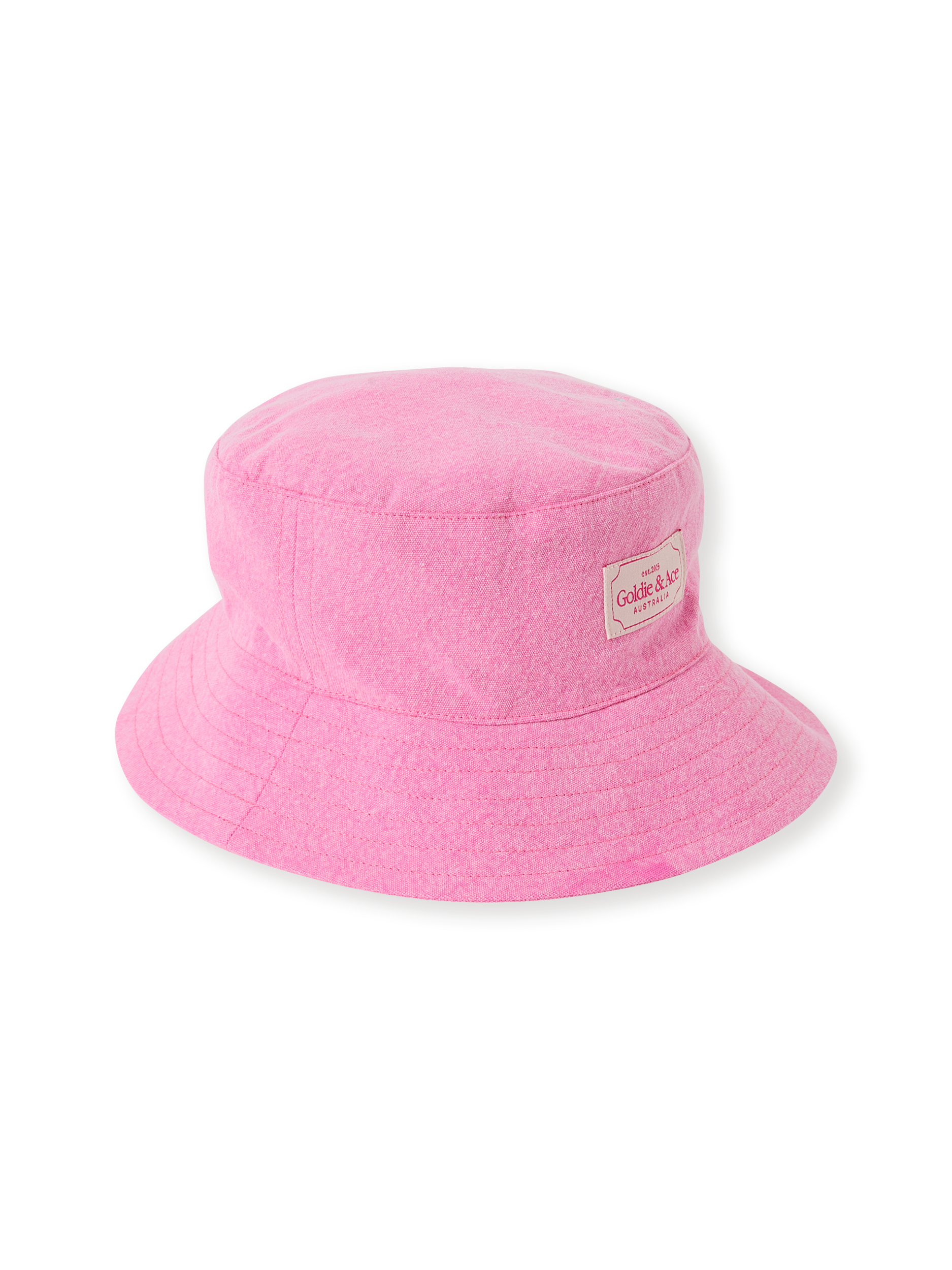 The Goldie + Ace Denim Bucket Hat in Pink Lemonade pictured on a transparent background. The material is cotton with cotton lining. It is a accessory made for babies, toddlers and kids.