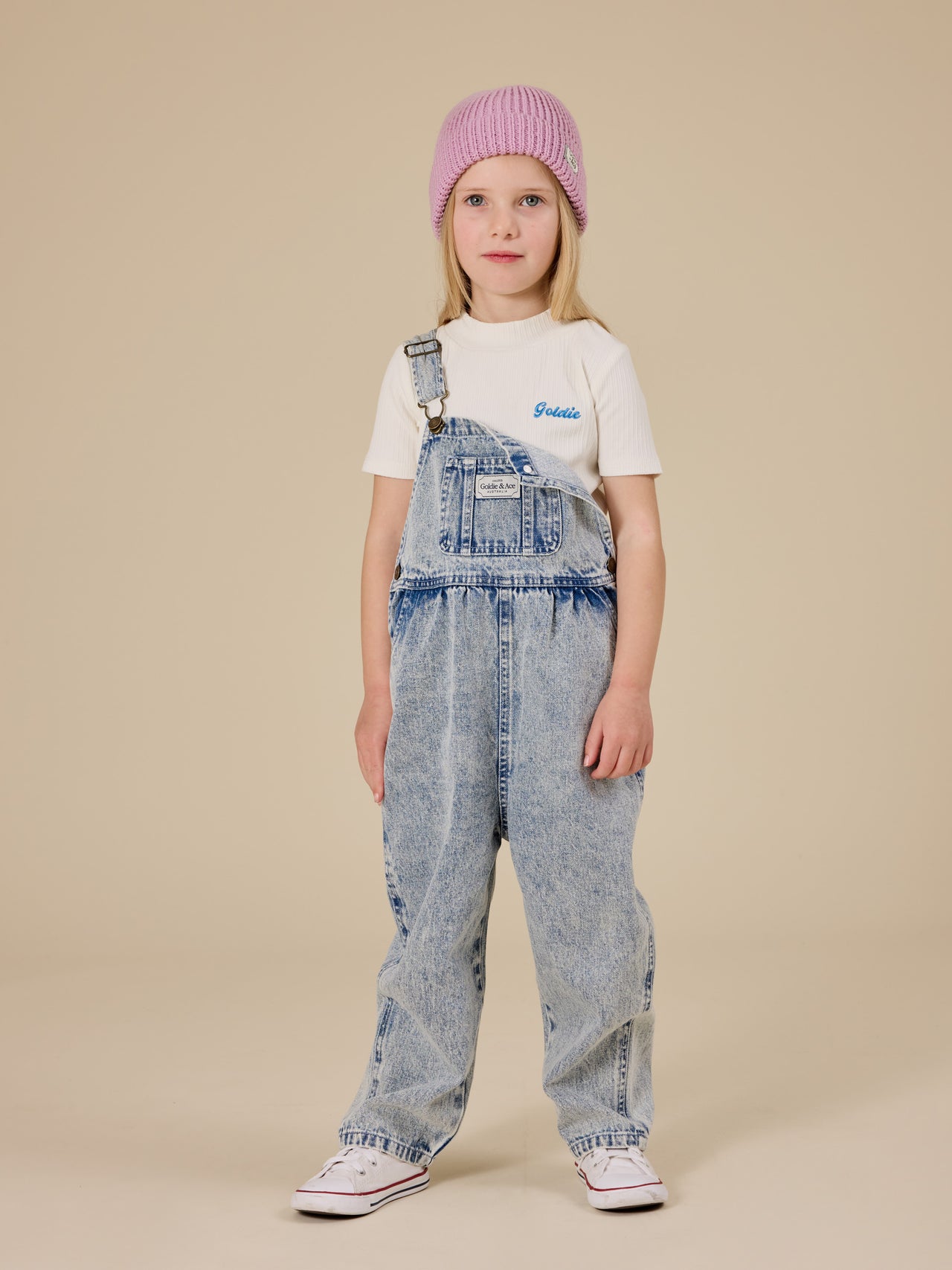 The Goldie + Ace Rib T-Shirt in White pictured on a transparent background. The material is soft cotton elastane. It is a top made for babies, toddlers and kids.