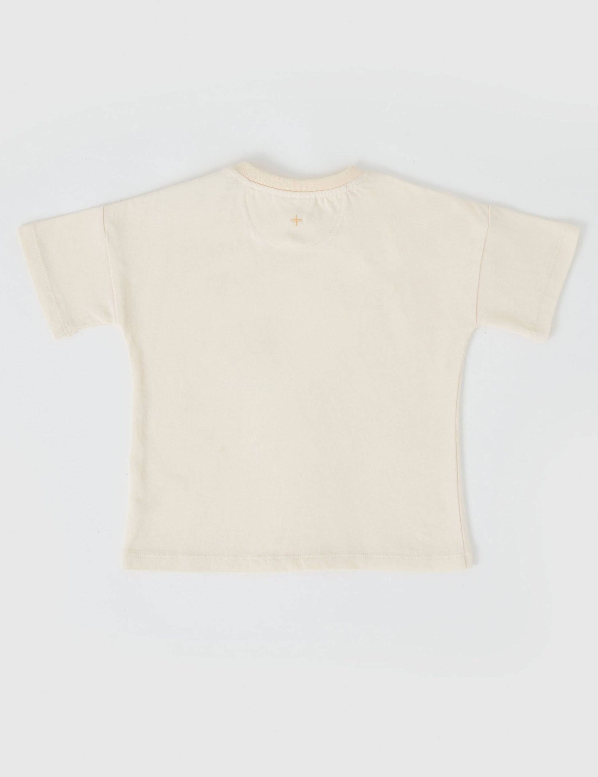 The Goldie + Ace Koala Puff Print T-Shirt in Ivory pictured on a grey background. The material is cotton jersey. It is a top made for babies, toddlers and kids.