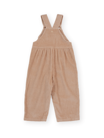 The Goldie + Ace Sammy Corduroy Overall in Tan pictured on a transparent background. The material is 100% cotton. It is a overall made for babies, toddlers and kids.