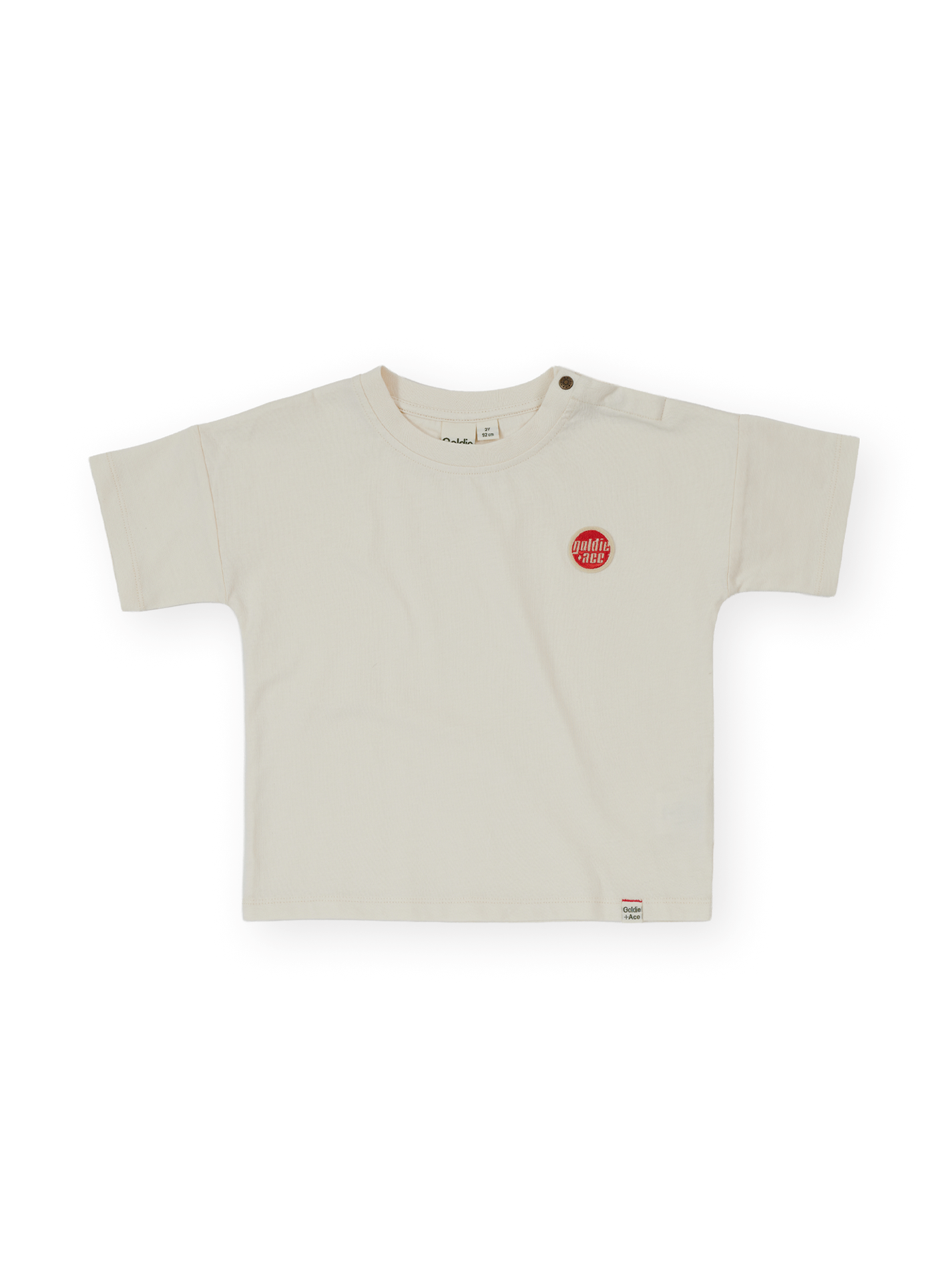 The Goldie + Ace Essential Logo T-Shirt in Antique White pictured on a transparent background. The material is 100% cotton. It is a t-shirt made for babies, toddlers and kids.