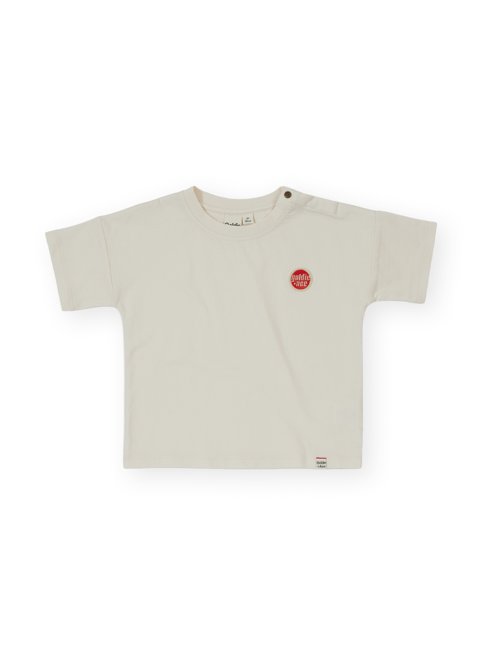 The Goldie + Ace Essential Logo T-Shirt in Antique White pictured on a transparent background. The material is 100% cotton. It is a t-shirt made for babies, toddlers and kids.