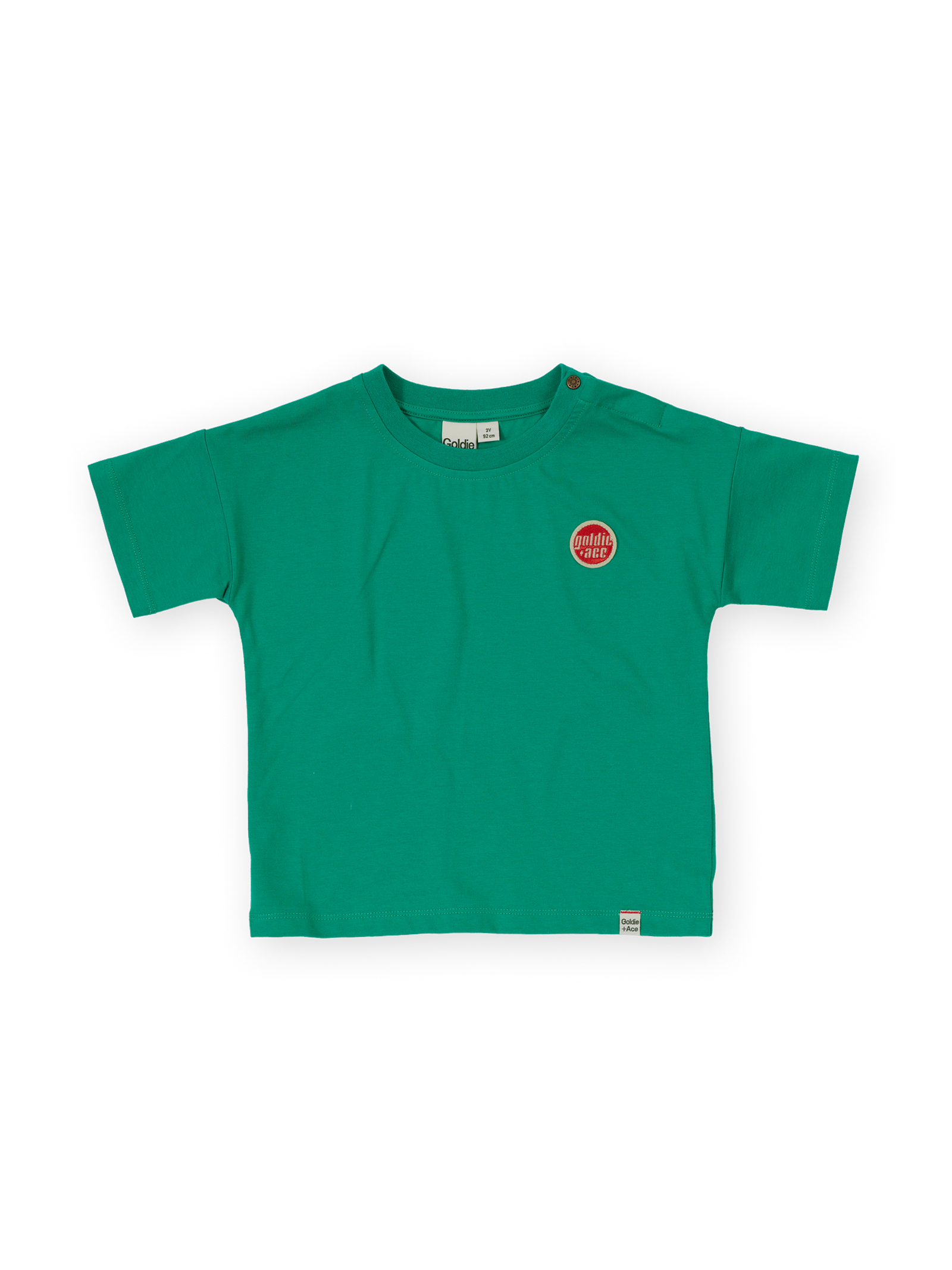 The Goldie + Ace Essential Logo T-Shirt in Green pictured on a transparent background. The material is 100% cotton. It is a t-shirt made for babies, toddlers and kids.