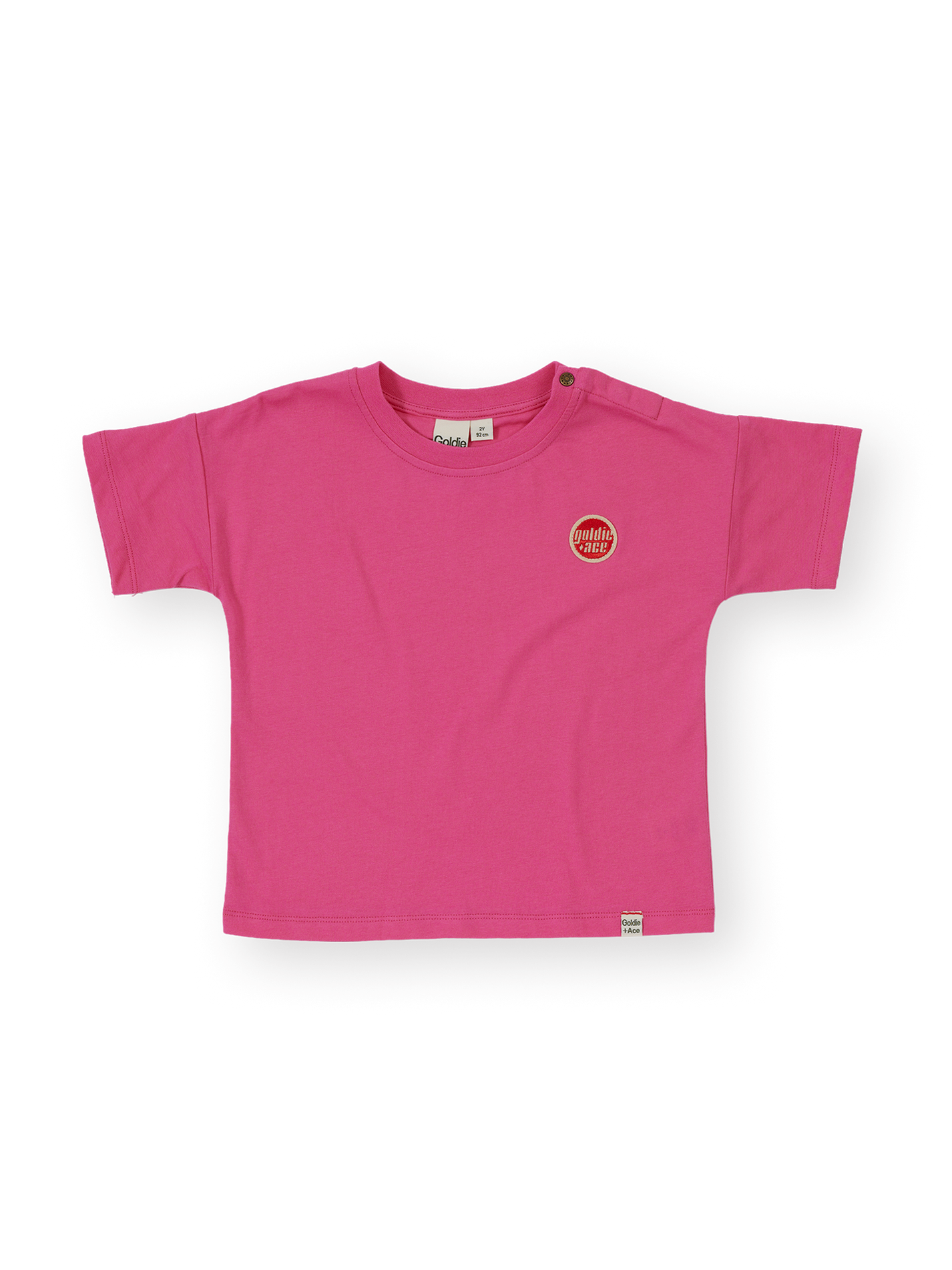 The Goldie + Ace Essential Logo T-Shirt in Pink pictured on a transparent background. The material is 100% cotton. It is a t-shirt made for babies, toddlers and kids.