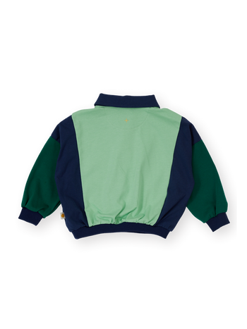 The Goldie + Ace Panelled Relaxed Rugby Sweat Top in Navy & Green pictured on a transparent background. The material is 100% cotton. It is a t-shirt made for babies, toddlers and kids.