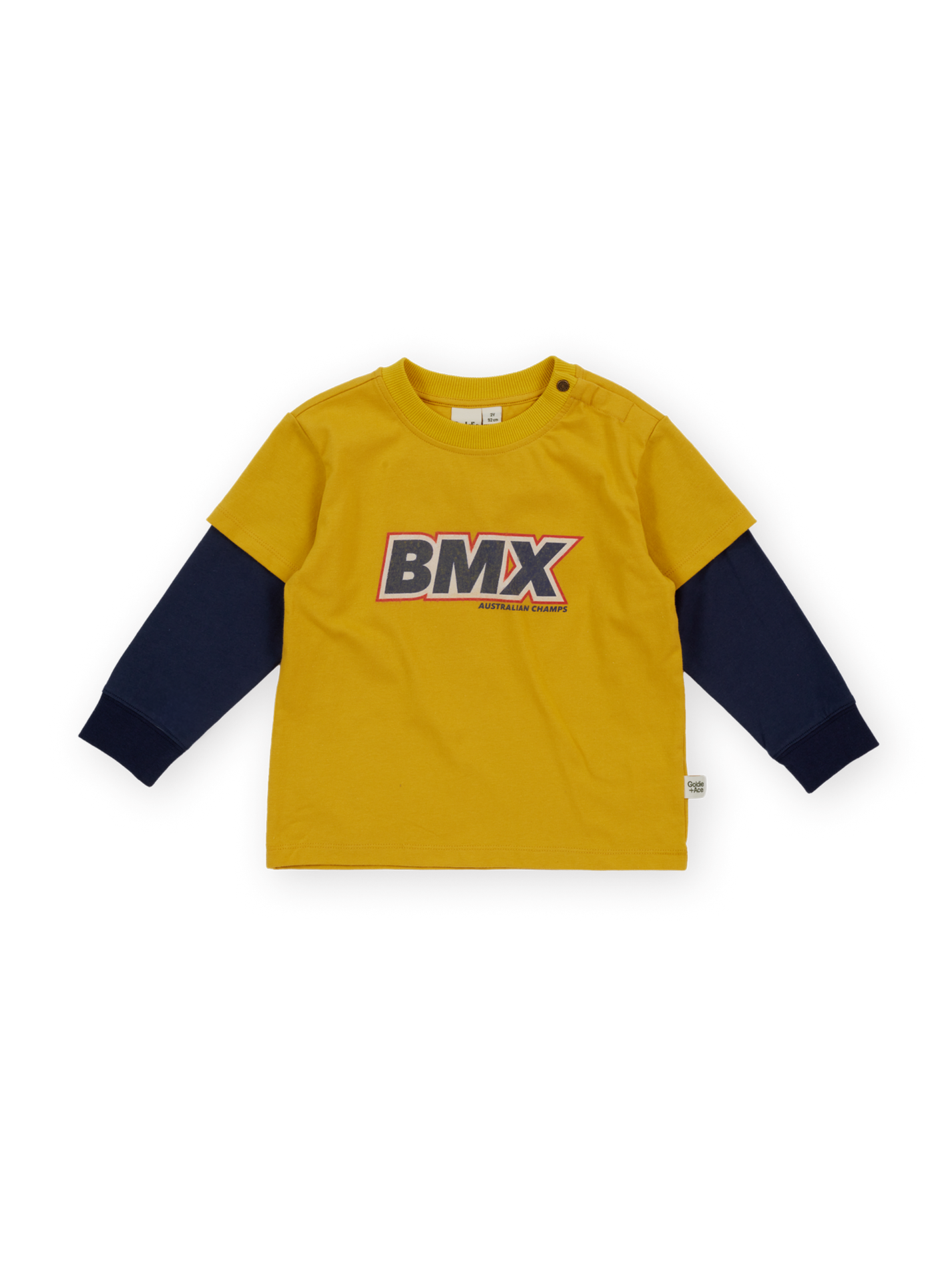 The Goldie + Ace Bmx Layered Longsleeve T-Shirt in Mustard pictured on a transparent background. The material is 100% cotton. It is a t-shirt made for babies, toddlers and kids.