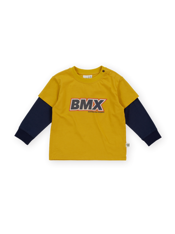 The Goldie + Ace Bmx Layered Longsleeve T-Shirt in Mustard pictured on a transparent background. The material is 100% cotton. It is a t-shirt made for babies, toddlers and kids.