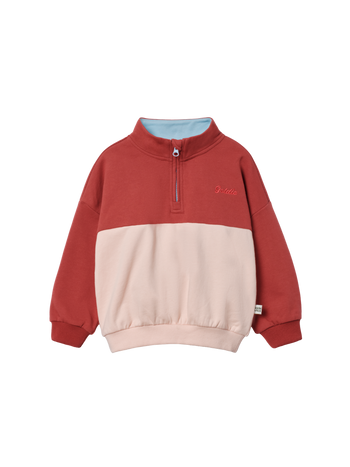 The Goldie + Ace Cololur Block Quarter Zip Sweater Peach in Rust/Peach pictured on a transparent background. The material is 100% cotton. It is a sweater made for babies, toddlers and kids.