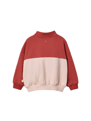 The Goldie + Ace Cololur Block Quarter Zip Sweater Peach in Rust/Peach pictured on a transparent background. The material is 100% cotton. It is a sweater made for babies, toddlers and kids.