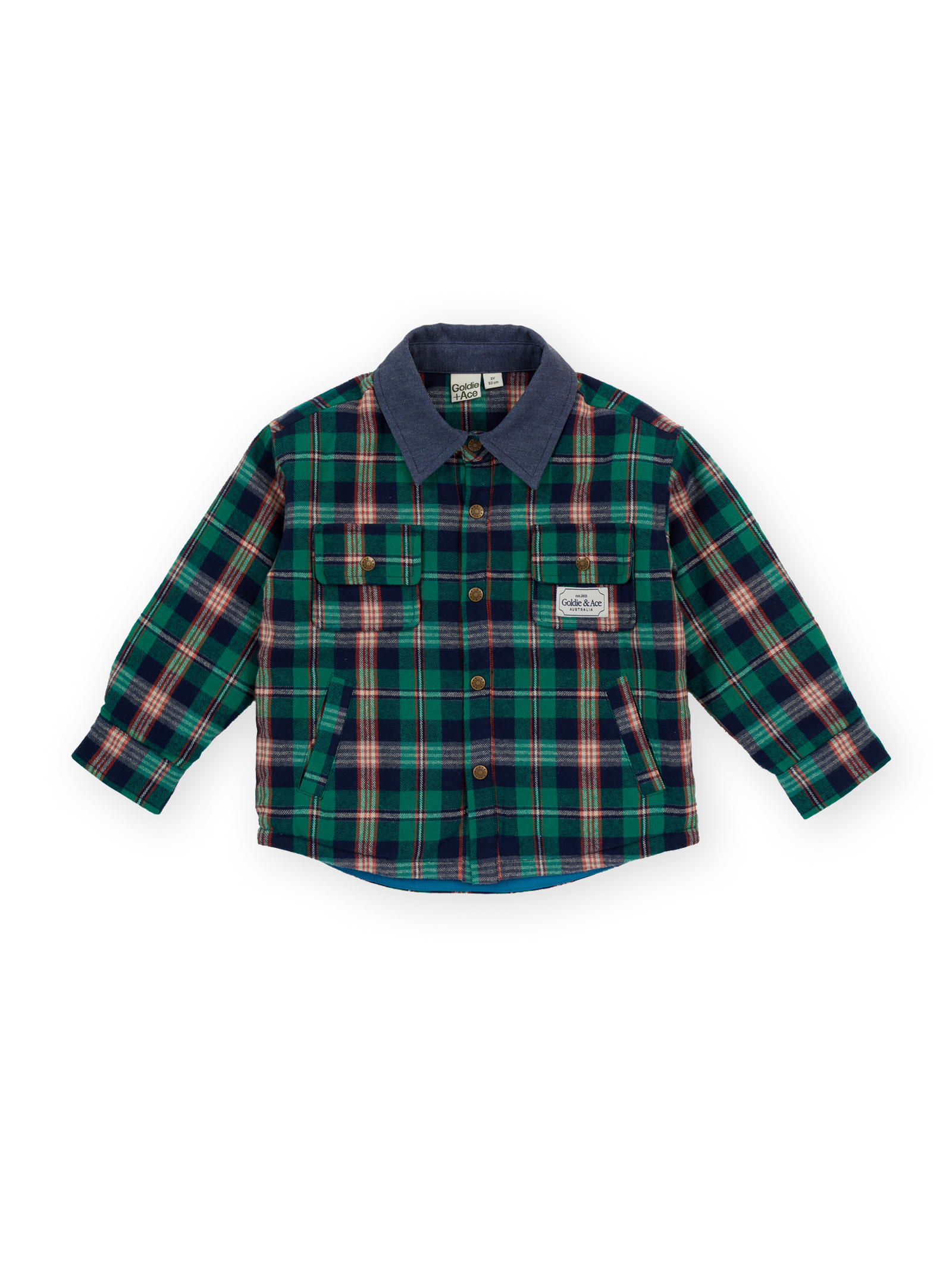 The Goldie + Ace Check Padded Shacket in Green Check pictured on a transparent background. The material is 100% cotton, with 100% polyester filling. It is a jacket made for babies, toddlers and kids.