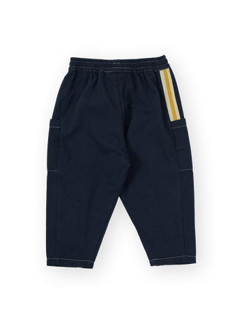 The Goldie + Ace Carpenter Utility Kit Pocket Pant in Navy pictured on a transparent background. The material is 100% cotton. It is a pant made for babies, toddlers and kids.