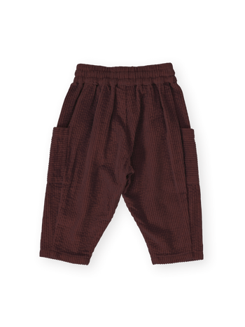The Goldie + Ace Kit Corduroy Pocket Pant in Brown pictured on a transparent background. The material is 100% cotton. It is a pant made for babies, toddlers and kids.