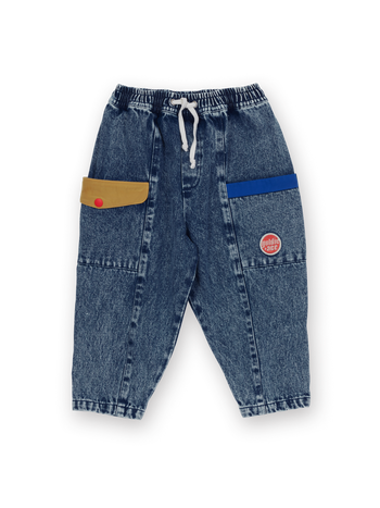 The Goldie + Ace Kit Colour Block Denim Pocket Pant in Dark Denim & Multi pictured on a transparent background. The material is 100% cotton. It is a pant made for babies, toddlers and kids.