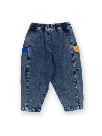 The Goldie + Ace Kit Colour Block Denim Pocket Pant in Dark Denim & Multi pictured on a transparent background. The material is 100% cotton. It is a pant made for babies, toddlers and kids.