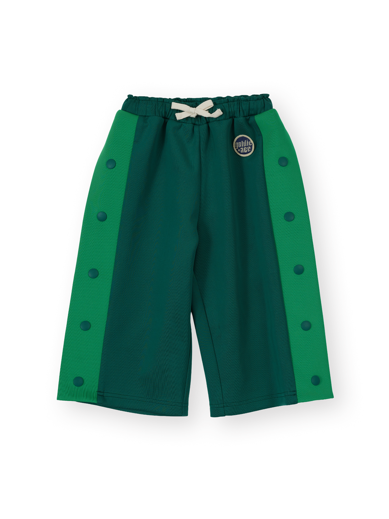 The Goldie + Ace Logo Track Snap Pants in Green pictured on a transparent background. The material is 100% polyester. It is a sweatpant made for babies, toddlers and kids.