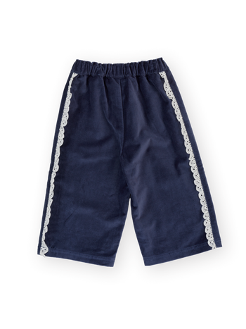 The Goldie + Ace Velour Broderie Wide Leg Pant in Navy pictured on a transparent background. The material is 100% cotton. It is a pant made for babies, toddlers and kids.