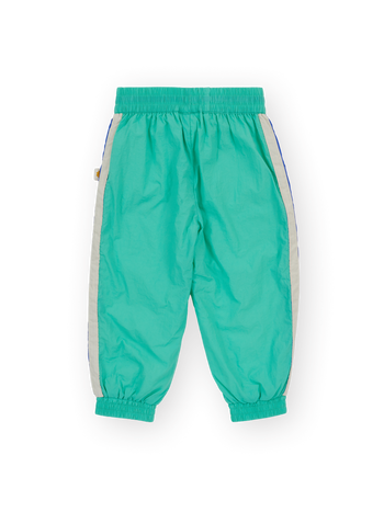 The Goldie + Ace Retro Lightweight Sporty Pants in Blue & Green pictured on a transparent background. The material is 100% polyester, filling: 100% cotton. It is a pant made for babies, toddlers and kids.