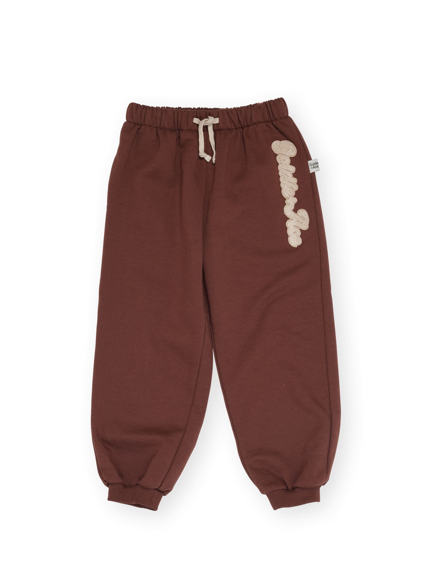 The Goldie + Ace Comfy Embroidered Sweatpants in Chestnut pictured on a transparent background. The material is 100% cotton. It is a sweatpant made for babies, toddlers and kids.
