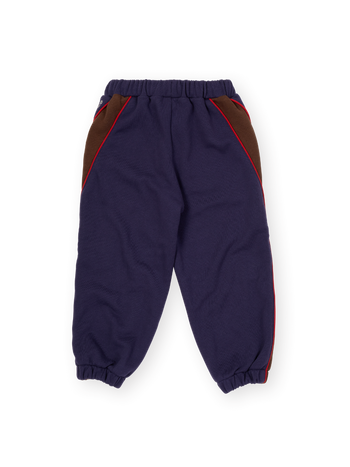 The Goldie + Ace Zig Zag Sweat Pant in Navy & Brown pictured on a transparent background. The material is 100% cotton. It is a sweatpant made for babies, toddlers and kids.