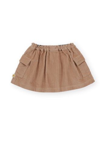 The Goldie + Ace Corduroy Pocket Skirt in Tan pictured on a transparent background. The material is 100% cotton. It is a skirt made for babies, toddlers and kids.