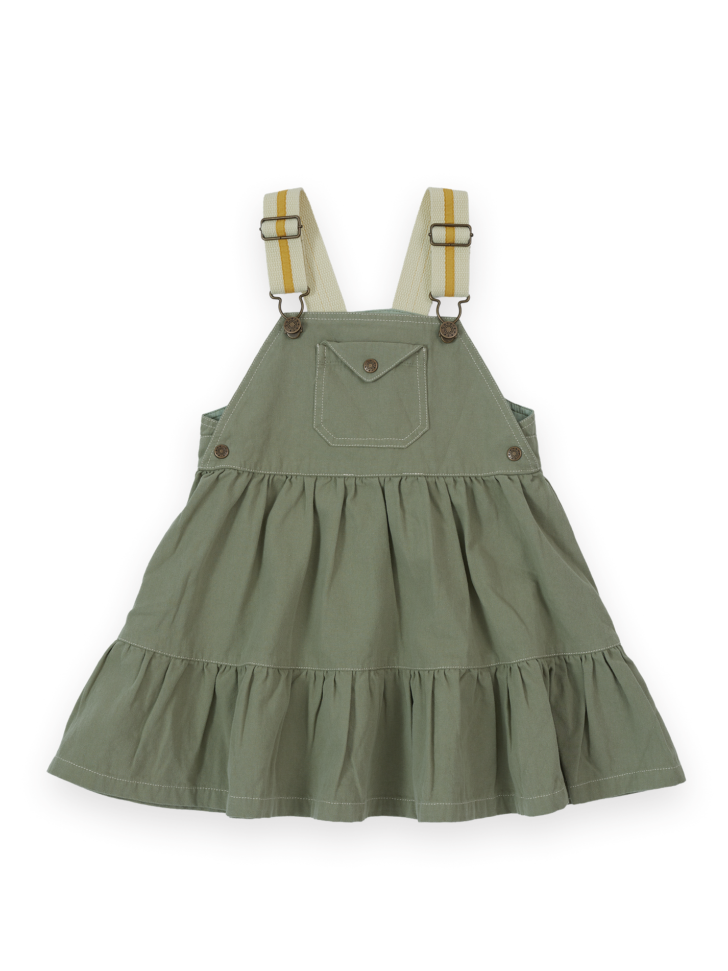The Goldie + Ace Carpenter Utility Pinafore Dress in Sage pictured on a transparent background. The material is 100% cotton. It is a dress made for babies, toddlers and kids.