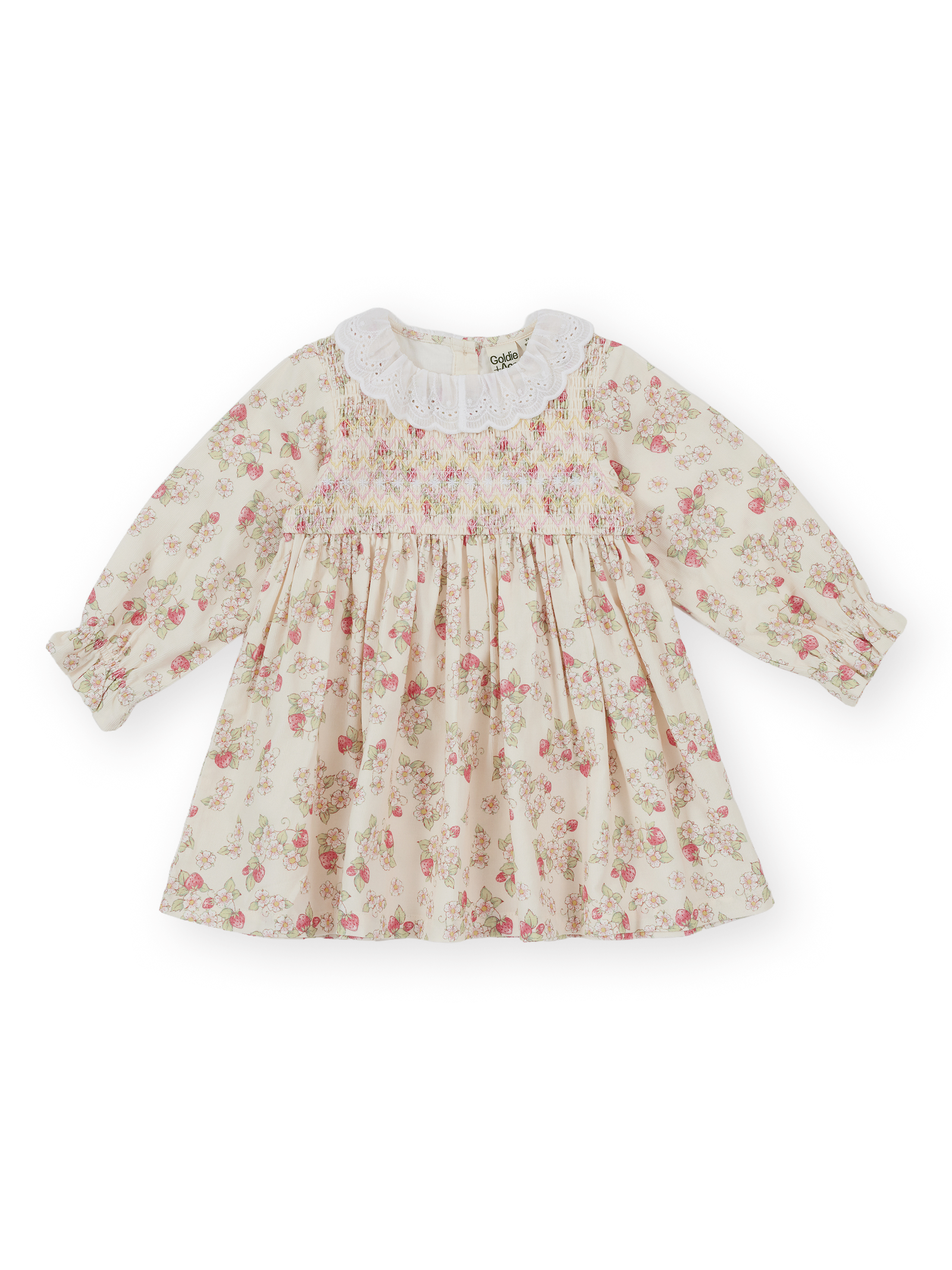 The Goldie + Ace Strawberry Fields Smocked Dress in Cream pictured on a transparent background. The material is 100% cotton. It is a dress made for babies, toddlers and kids.